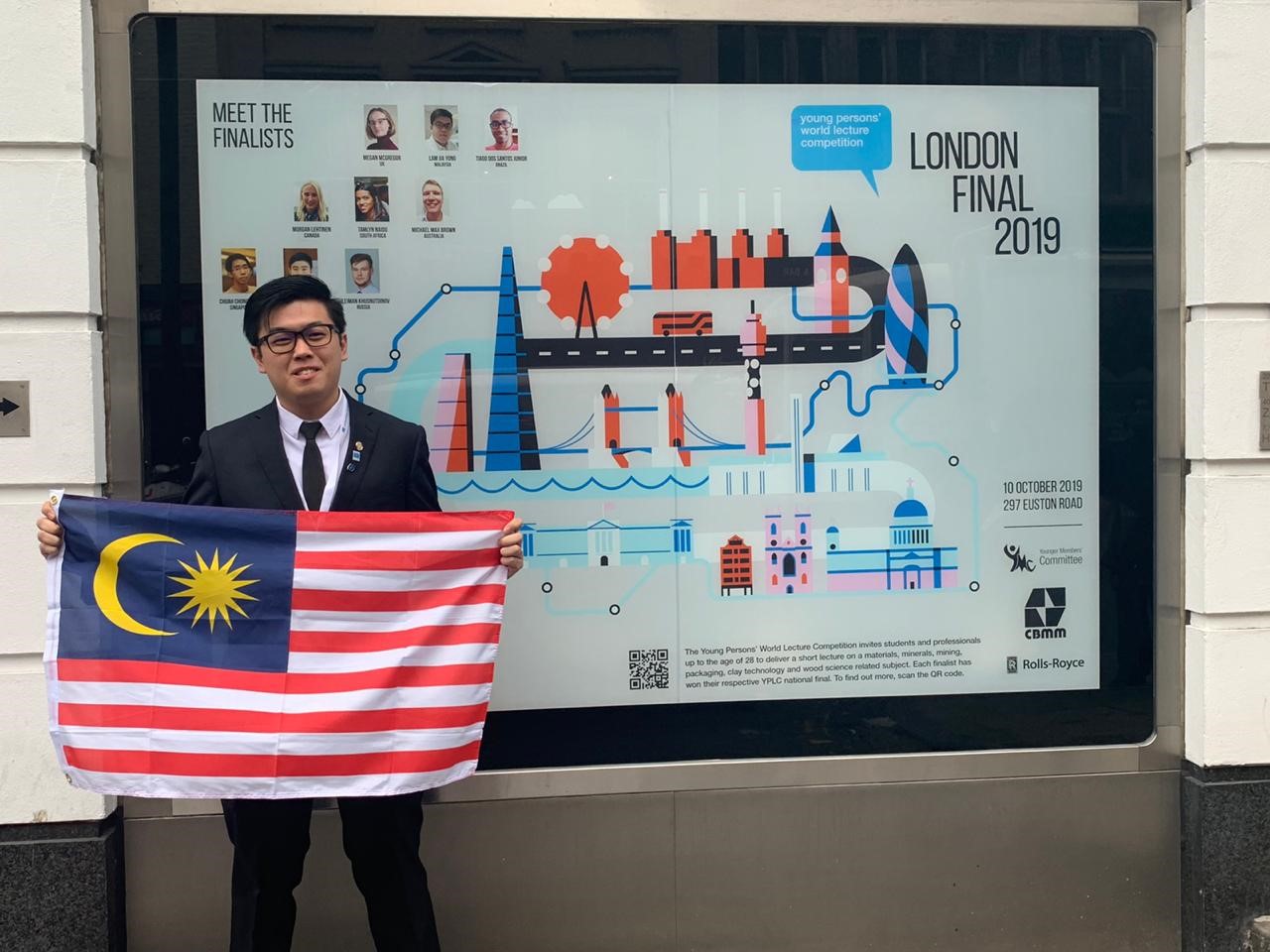 Jia Yong with the Jalur Gemilang in front of the Institute of Materials, Minerals and Mining (IOM3)